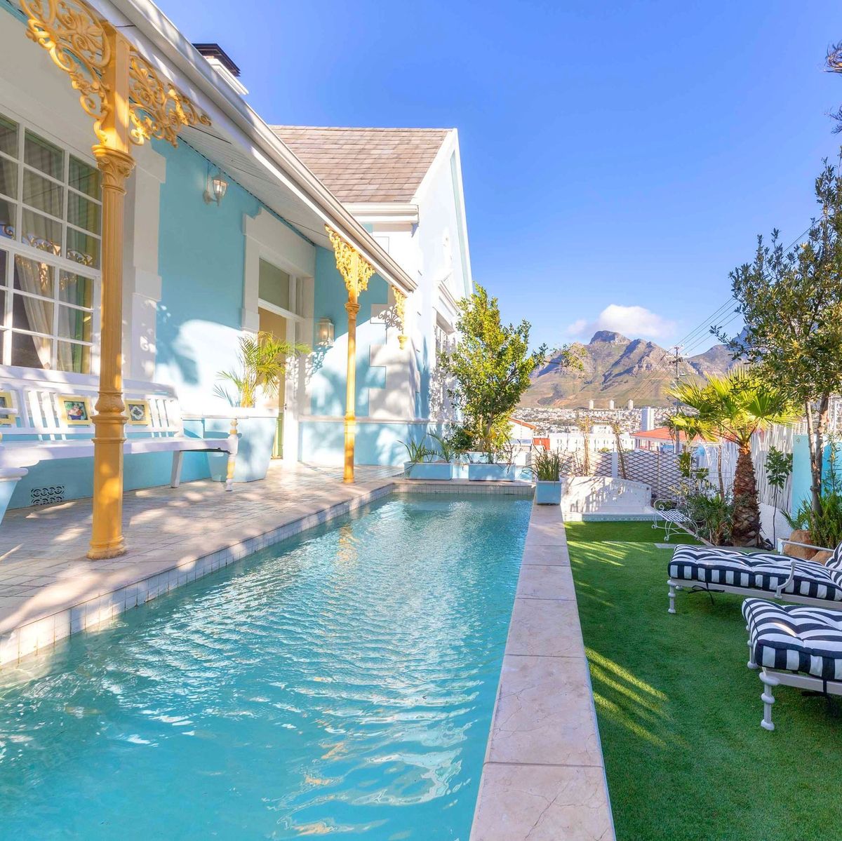 The long pool at Amina Boutique Hotel with the verandah and Table Mountain
