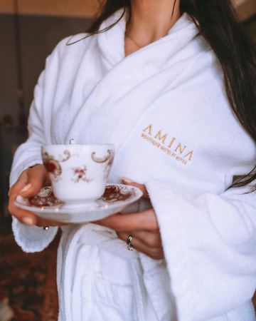 A teacup in hand and the Amina robe