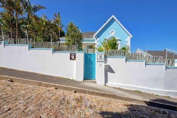 Amina from Whitford Street: the cobbles, the white wall and the blue gate
