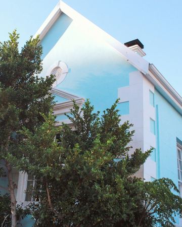 The side gable seen from below, with a tree