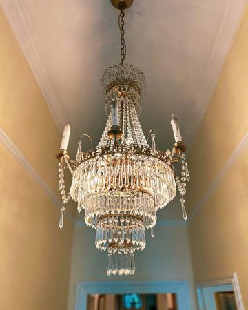 The crystal chandelier in the hall